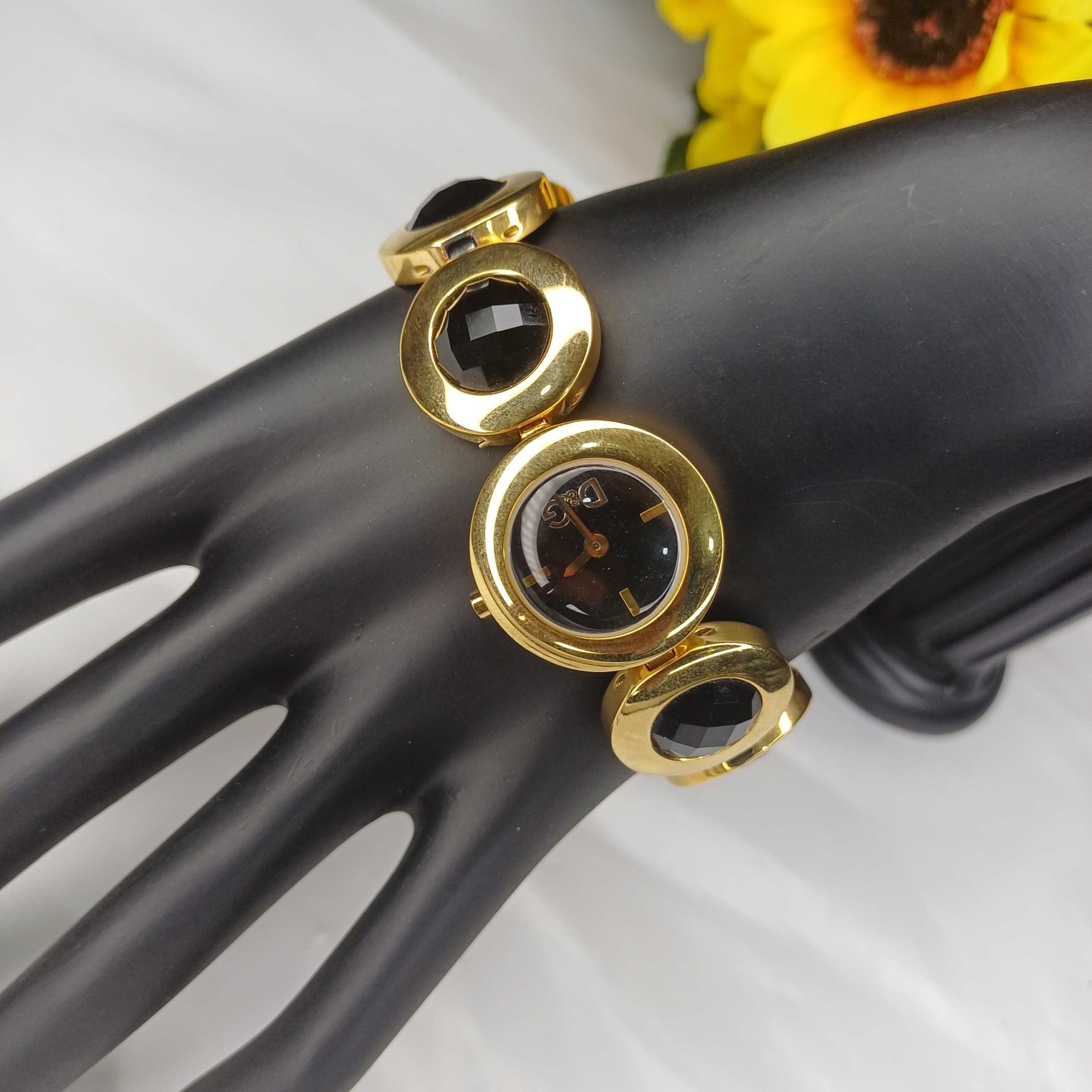 Elegant Gold-Tone Bracelet Watch with Black Gem Accents