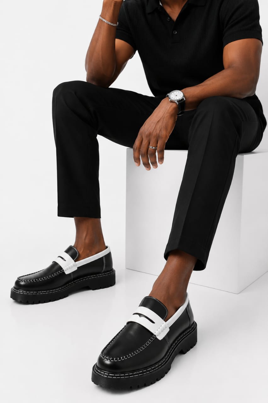 Classic black footwear styled with tailored trousers
